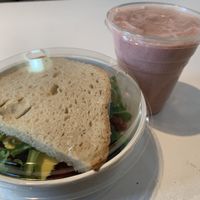 Vegan sandwich and strawberry smoothie at Roots Cafe in Cascais