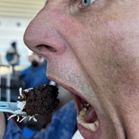 Hubby making a bigger face than needed for a bite of the delicious quinoa brownie.   at YWG - Green Carrot Juice Company in Winnipeg