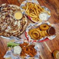 BBQ pizza (vegan option), chips, onion ring and buffalo vegan wings at Varsity Project in Morley