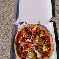 Veggie pizza: vegan sausage, mozarella, jalepinos and misc.   at Pizza Punks in Belfast