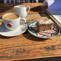 Soya milk flat white and delicious carrot cake 😊  at Meraki Market Cafe in Paphos