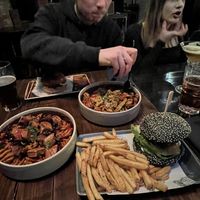 bottom to top - syko burger, festive fries, satay fries, blue christmas burger   at Church - Temple of Fun in Sheffield