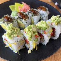 Two different sushi dishes plated together (sunshine rolls and rainbow rolls)  at Silk in Korcula