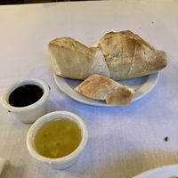 They will provide garlic olive oil and balsamic with their free bread in place of butter.  at Grounds Restaurant in Murphys