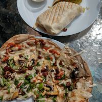 pita bread pizza (vegan) and falafel wrap (vegan) at Earth Cafe in Gothenburg