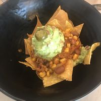Nachos con guacamole y alubias at La Huella Vegana - Las Rozas in Madrid