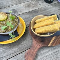 Chickpea curry and polenta fries  at Murni Food in Antwerpen