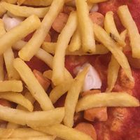 pizza with vegan chees and vegan wurstel and fries at Al Carmine in Padua