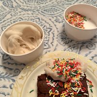 Vanilla soft serve with rainbow sprinkles. The brownie is from the black dog cafe😄 at Ben & Bill's Chocolate Emporium in Oak Bluffs