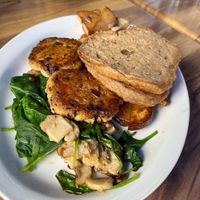 Vegan Fill-Up breakfast plate. Two vegan patties, sautéed spinach and garlic mushrooms, sunrise potatoes and toasted English muffin.   at Sunrise Cafe in Yellow Springs
