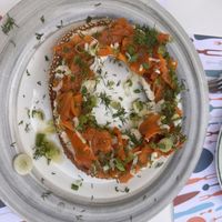 It’s a bread roll made with cashew cream, carrots and herbs on top. Super delicious!!   at Pulse in Crete