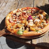 Half half pizza! Meatlovers and can't remember the other at Doko Demo V in West Burleigh