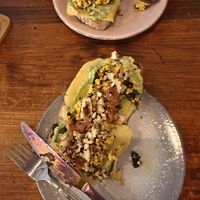 Toast with scrambled tofu, cheese, avocado snd walnuts at La Tienda de Los Unicornios in Granada