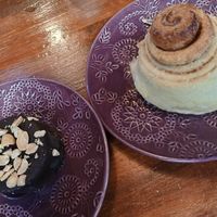 Chocolate and caramel cake and cinnamon bun. at La Tienda de Los Unicornios in Granada