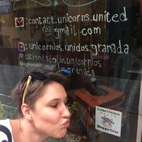 The unicorns, me, and the Happy Cow, all together having fun in Granada!  at La Tienda de Los Unicornios in Granada