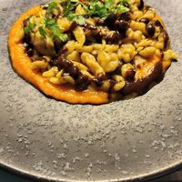vegan gnocchi with porcini mushrooms & black garlic on a pumpkin cream sauce & crispy chips at Ristorante Lo Stornello in Stresa