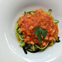 Vegetable tagliatelle - vegan dish made with zoodles with tiny cubed tofu pieces  at Ristorante Lo Stornello in Stresa