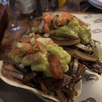 The Vegan with bean burger strips, caramelized onions, tomatoes, onions and guacamole in soft flour tortillas  at The Fat Cactus - Gardens in Cape Town