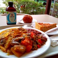 Delicious curry tofu with mushroom sauce, vegan pie and baked apple at Celeiro - Roma in Lisbon