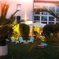 Lounge area just in front of the restaurant terrace. at Restaurantcafe in der ALTEn MÜHLE  in Bad Vilbel
