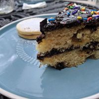 Vanilla cake with apple and chocolate ganache. And Alfajor con mermelada de moras. at Capra in San Jose