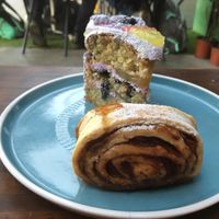 blueberry and lemon cake and cinnamon roll at Capra in San Jose