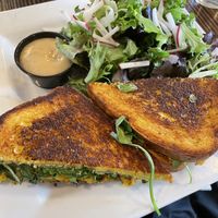 Curry cauliflower sandwich with salad and shallot dressing  at ERIS Brewery and Cider House in Chicago