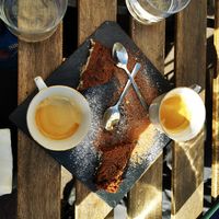 Coffee with small piece of complimentary peanut butter chocolate cake at La Table à l'Envers in Marseille