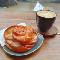 Latte and cinnamon bun at Hampton & Vouis in Manchester