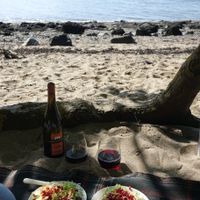 Sprout, pomegranate and walnut salad; wine and glasses; beach. at Wedgwood in Edinburgh
