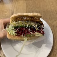 The millennium burger on a gluten free bun at Pilgrims Vegetarian Cafe in Corrimal
