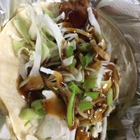 Fried tofu taco with teriyaki, grilled pineapple, cabbage, scallions. They call it vegan, but the tofu is fried in the same oil as animal meat, so it’s not 💯 pure vegan.  at East Coast Taco in Niantic
