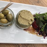 Cumin, garlic and butter bean houmous, salad and garlic stuffed olives at The Garlic Farm in Sandown