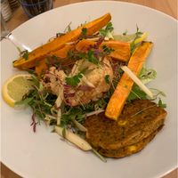 Roasted cauliflower and sweet potato salad with quinoa and a zucchini fritter.  at Cafe No 11 in Rayleigh