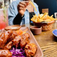 Chicken wings and fries were the best!   at Om Sabor in San Francisco