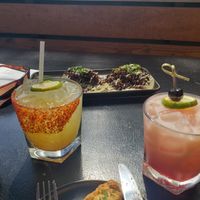 Hotter than Hell cocktail on left and Lime in the Coconut cocktail on right at Om Sabor in San Francisco