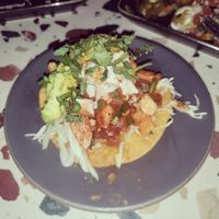 Tostada in bad lighting at Om Sabor in San Francisco
