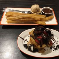 Churros with dark chocolate dip and salted caramel ice cream, and the salted caramel and oreo churro bowl. at San Churro  in Glebe