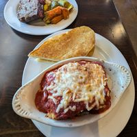 Top - Meatloaf, mashed potatoes and veg.  Bottom - Lasagne and garlic bread. at Ethos Vegan Kitchen in Winter Park