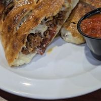 "sausage pepperoni" calzone with tofu feta. seriously the best calzone I've ever had!!! at Bodacious Bakehouse in Virginia Beach