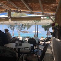 The restaurant is located right next to the ocean. at Copa Cabana in Patmos