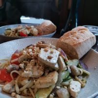 vegan pasta with grilled veggies (zucchini, paprika, celery, onion, mushrooms) and added marinated tofu. The dish came with warm bread and pine seeds and all together it was very t at Cafe au Lait in Berlin
