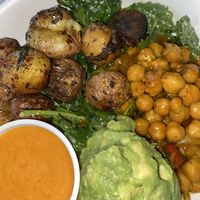 4 bowl. Bases: Vegan Kale Caesar and Coconut ginger rice. Vegetables: Chickpeas and vegan truffle potatoes. Vegan coconut Sriracha as a side sauce at Fresh Kitchen - Westshore in Tampa