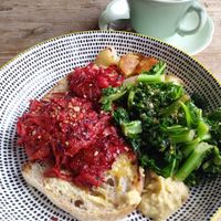Vegan breakfast..hummus , sourdough, potato, greens. Delicious. at The Cow Bog in Londonderry