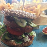 The vegan burger with fries and ketchup. at Café Fru Dax in Romo