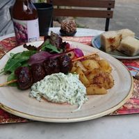 Great vegan lunch option "Souvlaki" with lemonbaked potatoes, tzatziki and sallad. Coffee and ball of chocolate nuts in background. at Byvägen35 in Sankt Olof