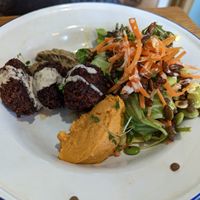 Harissa falafel, carrot hummus, Baba ghanoush and salad at Hullabaloo in Ipswich