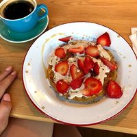 vegan waffle with maple syrup, strawberries, and coconut cream! at Hullabaloo in Ipswich