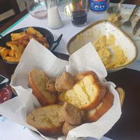 Double-fried fries, garlic bread, fava dip. Vegan yummy at Portego in Crete