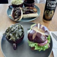 The Norma classic fried chicken sandwich with side of collard greens and The Dip steak style sandwich with Sesame slaw.  Absolutely delicious!  at The Wayside Cafe & Deli in Olympia
